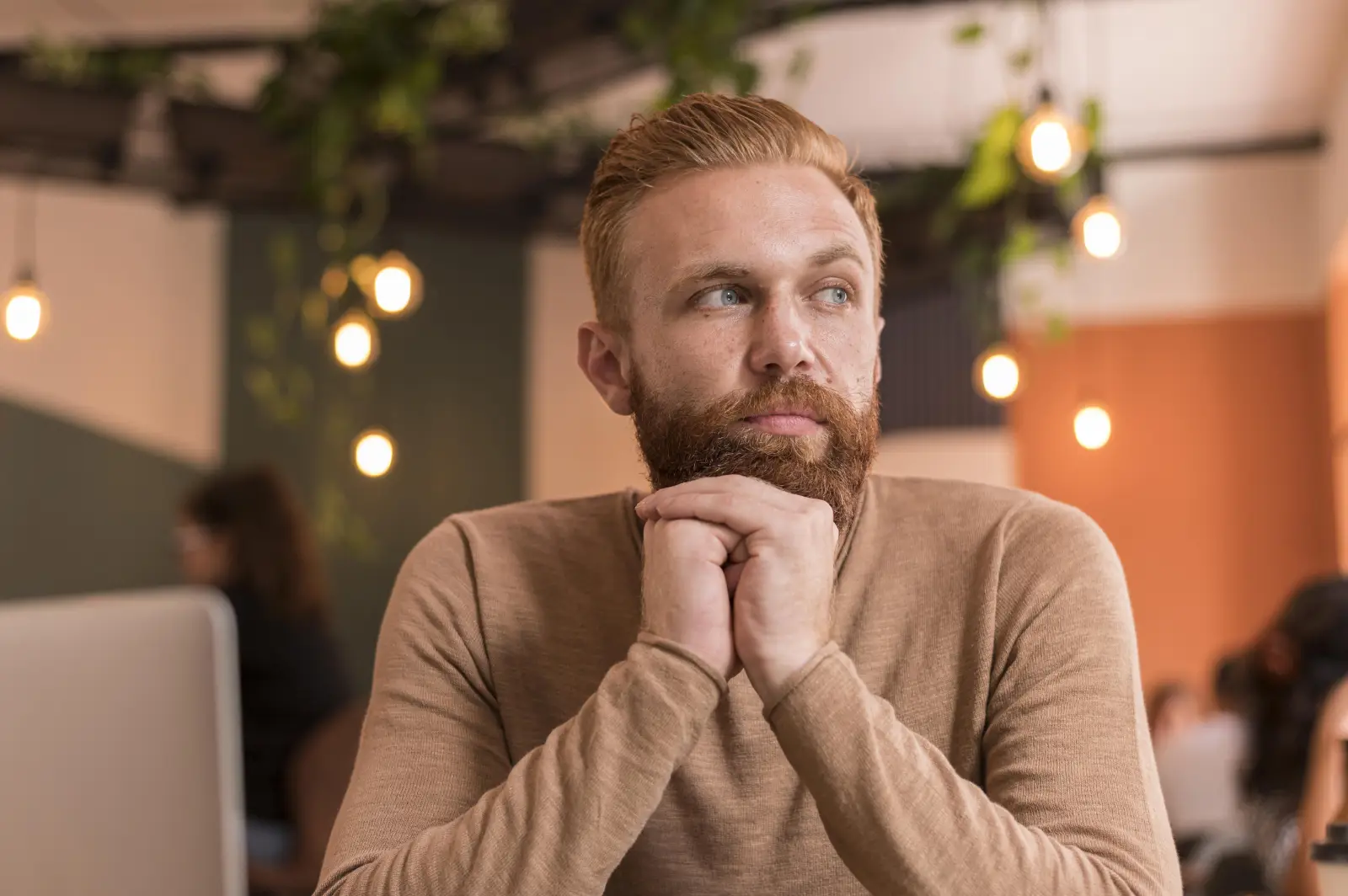 Warm café workspace evoking a considered money decision