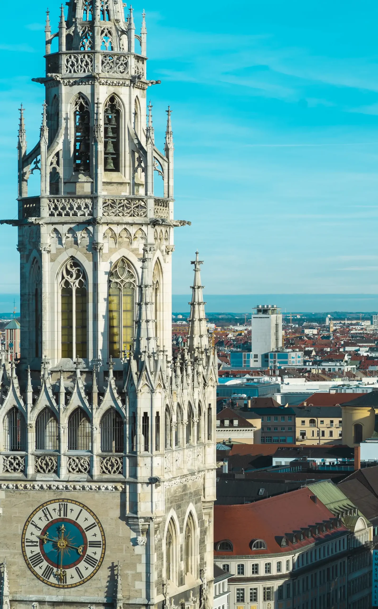 Munich town hall over the city — savings habits brought from another country